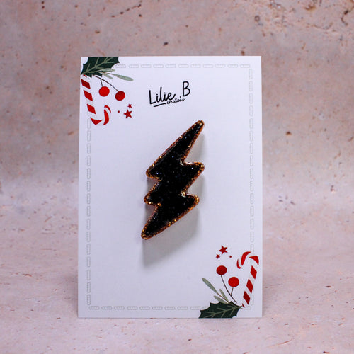 Pin’s Éclair Or & noir