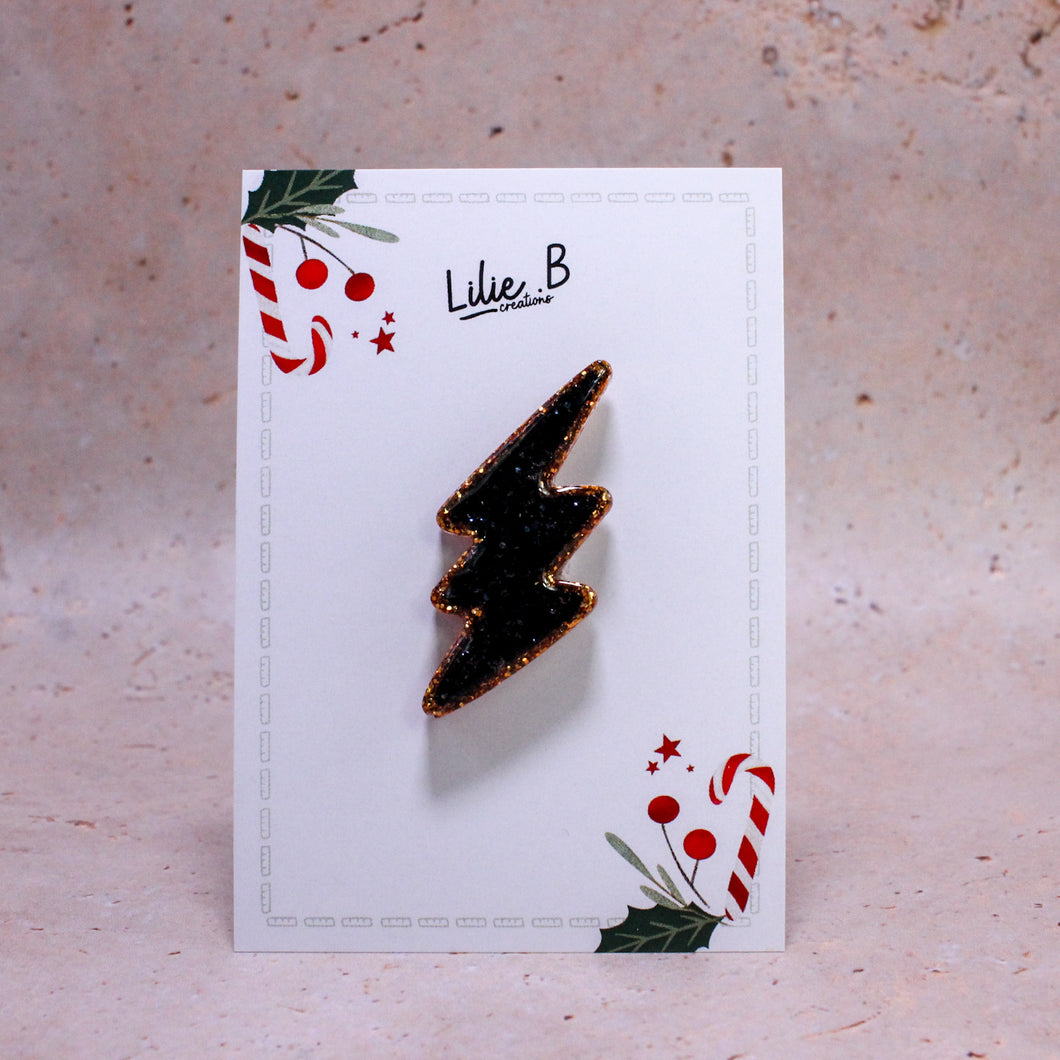 Pin’s Éclair Or & noir